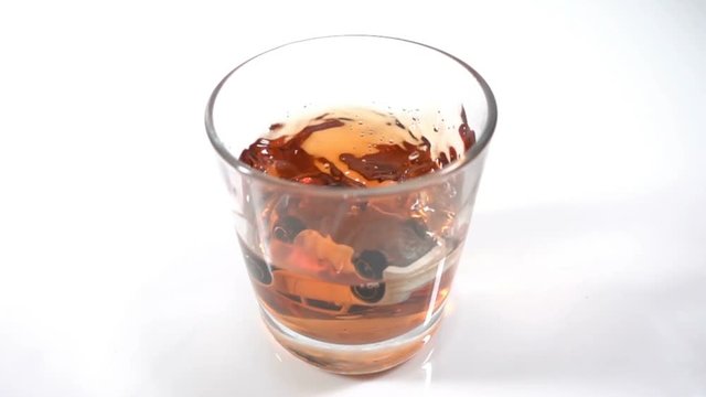 alcohol abuse, drunk driving - the car falls into a glass with alcohol, the concept of an accident while driving in a drunken state, Slow motion