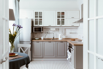 Scandinavian interior design. White grey kitchen room organization - obrazy, fototapety, plakaty
