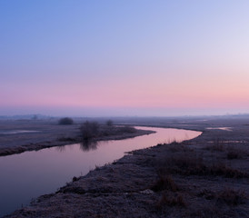 sunrise above the spring, frozen river 