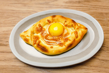 Khachapuri is traditional Georgian and Caucasus cheese and egg filled bread in shape of a boat