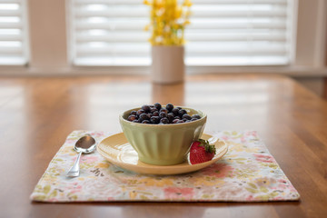 Morning bowl of cereal with fresh berries