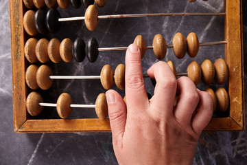 Vintage abacus on wooden background