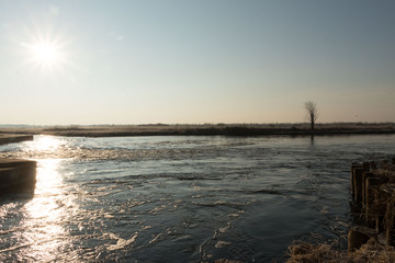 the autumn river with great sun rays 