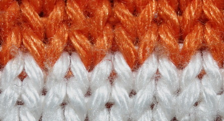 the texture is chunky, two-tone orange-and-white close-up, macro
