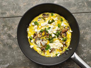 Obraz na płótnie Canvas Omelett mit Pilzen - Omelette with mushrooms