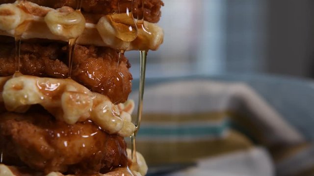 Close Up of Syrup and Waffle Falls Down Chicken And Waffles