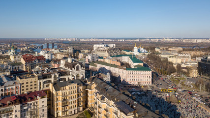 Fototapeta premium view on the modern buildings in the city center, St. Andrew's Church, Podolsky Bridge and the left coast of the city Kiev, Ukraine