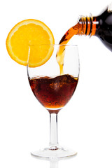 Cola drink poured in glass