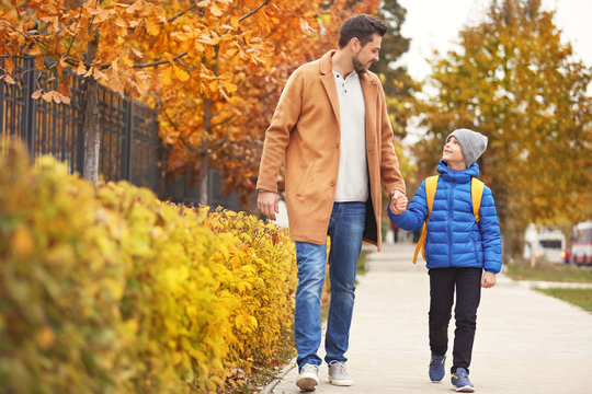 Cute Little Boy Going To School With His Father