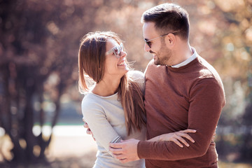 Young loving couple in the park