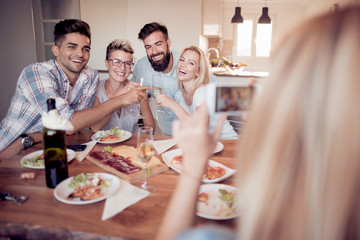 Portrait of happy friends taking selfie