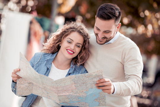 Tourist couple with map