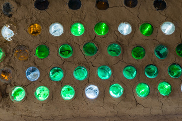 Obraz na płótnie Canvas Colorful bottles in a wall, bottle wall mosaic