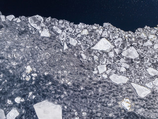 Aerial view of the ice texture broken into pieces of different shapes and sizes 