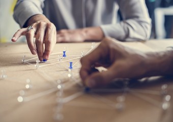 Hands holding connecting pin network