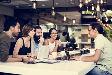 Diverse colleagues people gather up together working on laptop