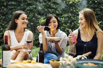 Diverse people enjoying food togethr