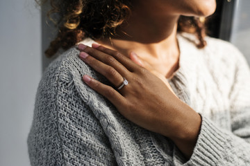 Cheerful woman with engagement ring - obrazy, fototapety, plakaty