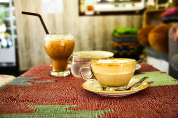 Hot and cold coffee in room background