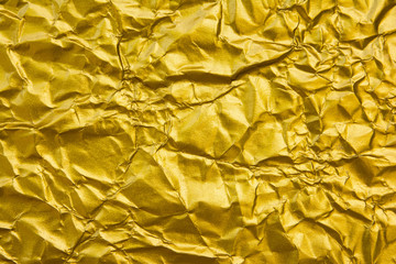 Yellow wrinkled gold texture background