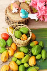 chilli peppers for cooking on wood background