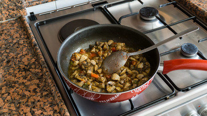 mushrooms and onions roasted  on frying pan