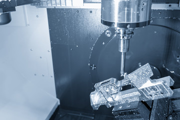 The table  tilt type 5-axis CNC milling machine cutting the aluminium aerospace part with solid ball endmill in the light blue scene.