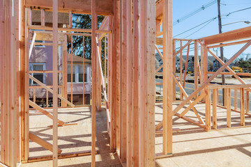 Fototapeta na wymiar Wood Building frame at Multi-Family Housing Construction