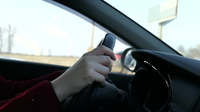 Woman With Steering Wheel Driving In Sunny Day