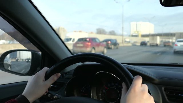 Woman With Steering Wheel Driving In Sunny Day