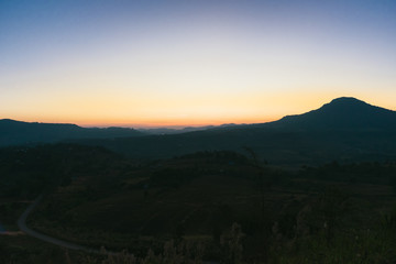 Fototapeta na wymiar Mountain landscape and light rays before sunrise.