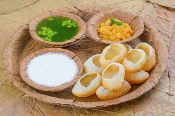 Indian Street Food Pani Puri Also Know as Golgappa or Golgappe is a Common Street Snack From India. It Consists of a Round, Hollow Puri Filled With a Mixture of Flavoured Water And Other Chat Items.