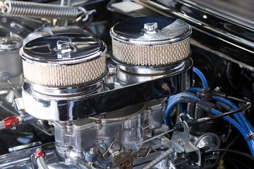 An engine with twin carburettors and air filters