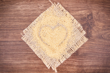 Amaranth in shape of heart, healthy food containing vitamins, minerals and dietary fiber