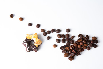 Coffee cup and beans on old kitchen table.