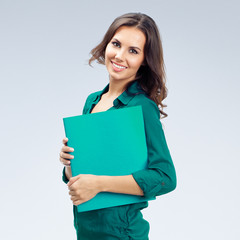 Obraz premium Businesswoman with folder, on grey