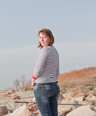 Portrait of a beautiful middle aged woman on the beach