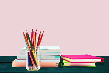 Books ,pen,pencil and office equipment on pink background, education and back to school concept,Clipping path