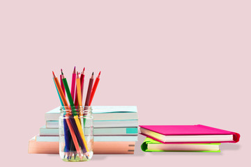 Books ,pen,pencil and office equipment on pink background, education and back to school concept,Clipping path