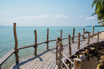 Paradise beach with wooden bridge
