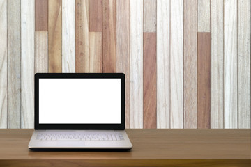 Mock up Laptop with blank screen on wooden table with modern interior background.Mock up business concept.