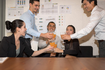 Group of business people have a drink in office after meeting,provide good employment conditions for new project.