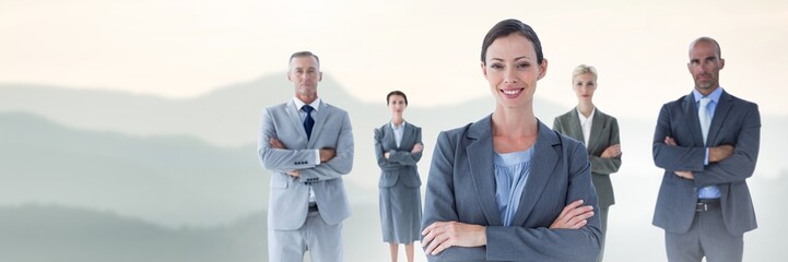 Business people and mountain landscape with flare light source