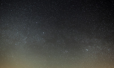 Night sky with a bright star of the Milky Way. Panoramic view of the starry space.