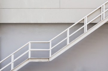 white steel stair background, fire escape metal stair with white handrial.