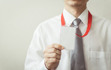 Man holding Identification card.