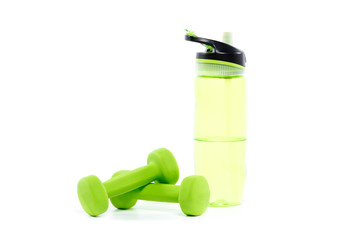Pair of green dumbbells with sports water bottle isolated on white background