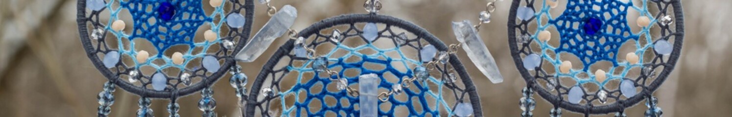 Banner of Handmade dream catcher with feathers threads and beads rope hanging