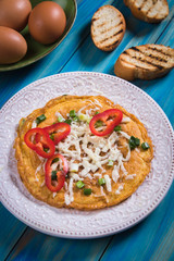 Omelet, fried chicken eggs with fresh vegetables