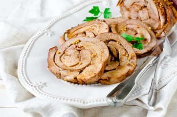 Baked roll from a turkey thigh with a grain mustard